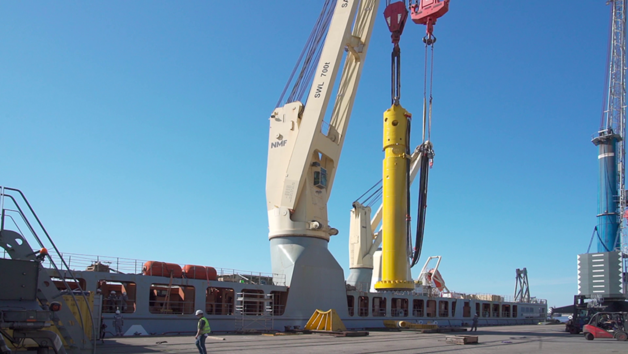 Menck MHU3500S hammer being lifted onto a vessel to head offshore to Kriegers Flak windfarm in the Baltic Sea to help install 72 monopiles.