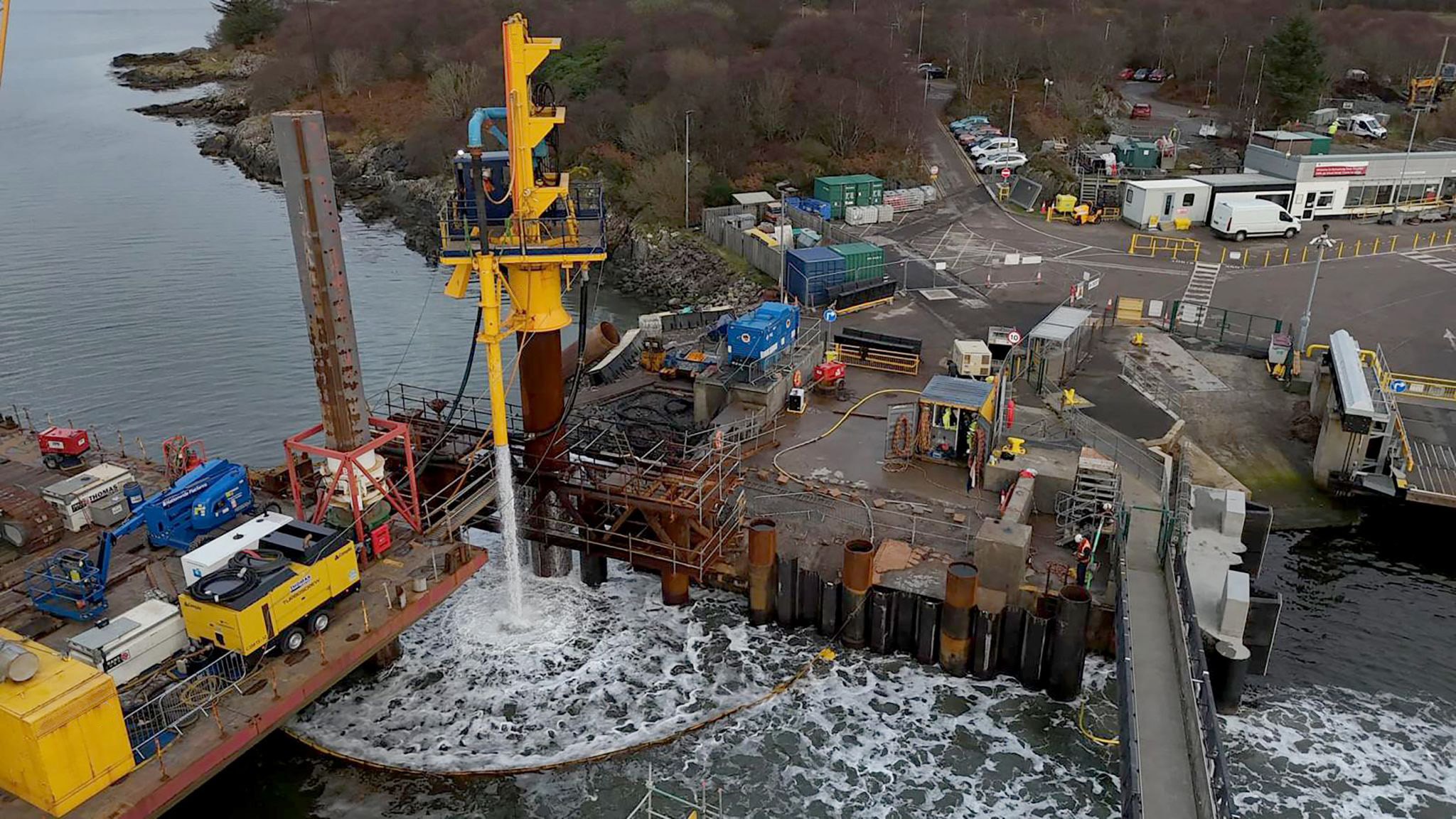 Reverse-circulation drilling operations undertaken from the temporary “conductor” pile. Spoil discharged adjacent to the drilling location via a fixed discharge pipe.