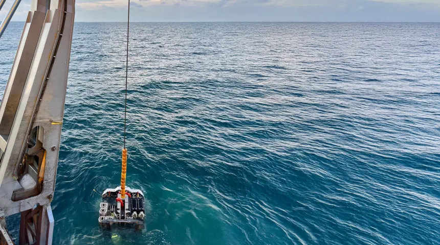 Portable remotely operated drill (PROD) being deployed into the sea