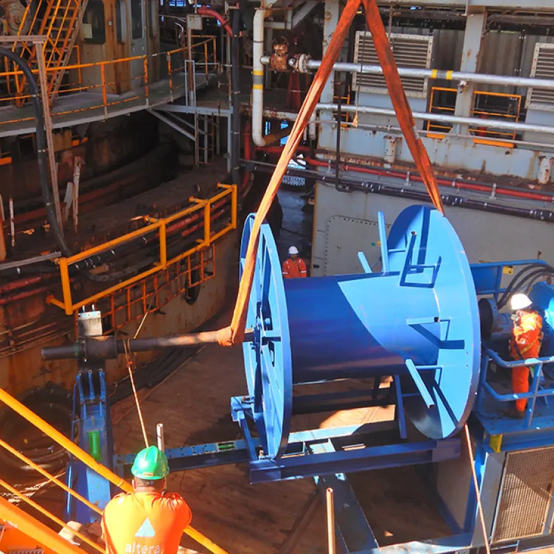 Offshore staff assembling a spooling unit offshore on the Petrojarl 1 FPSO offshore Santos Basin, Brazil