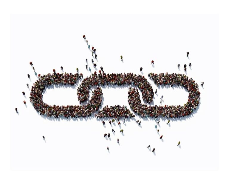Human Crowd Forming A Chain Symbol: Bonding And Social Media Concept