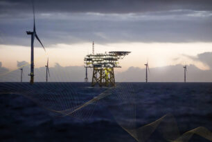 an offshore wind substation surrounded by turbines