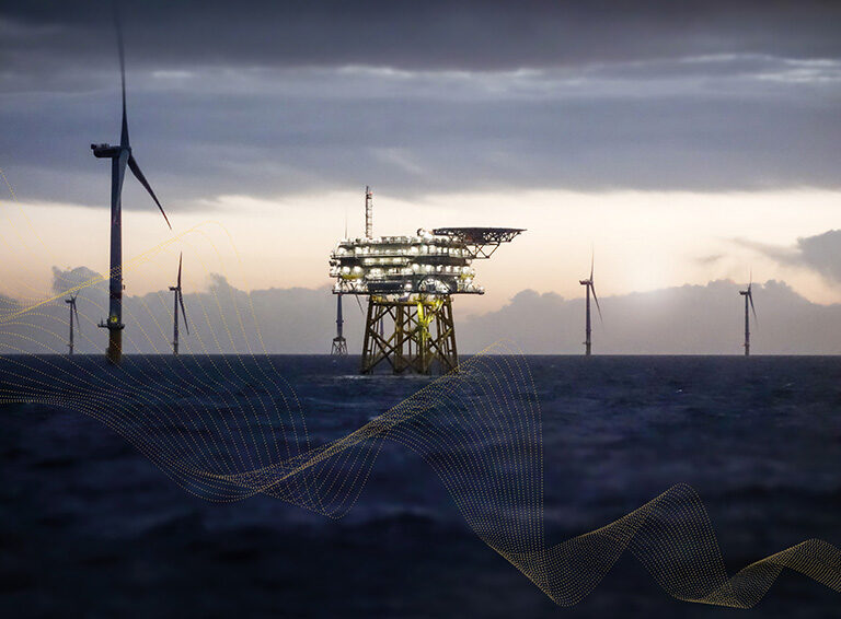 an offshore wind substation surrounded by turbines