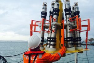 An offshore worker installing data loggers